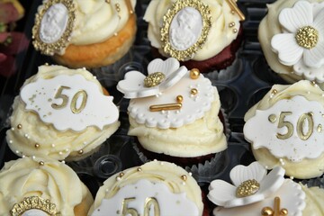 Beautiful cupcakes decorated with buttercream icing for fiftheeth anniversary