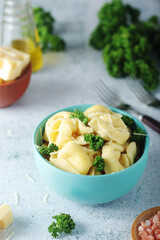 A bowl with Italian dumplings - tortellini	