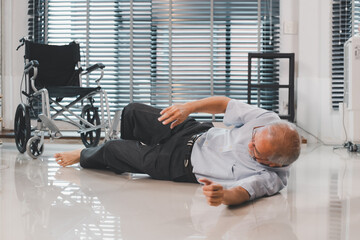 Motion Blur technique. Asian senior man falling down from wheelchair lying lying on the floor out of the wheelchair. Sick old man heart attack fainting fell on the floor. Life insurance health care.