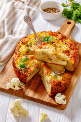 Cauliflower Cake with cheese, basil, top view