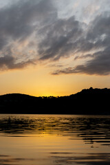 Beautiful sunrise with clouds in a lake 