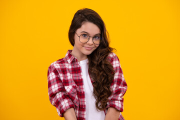 Happy teenager, positive and smiling emotions of teen girl. Headshot portrait of teenager child girl isolated on studio background. Childhood lifestyle concept. Mock up copy space.