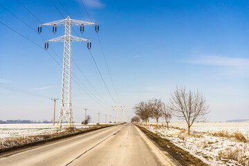 Winter season, view of cars and snowy street through windshield while driving in Bucharest, Romania, 2021.