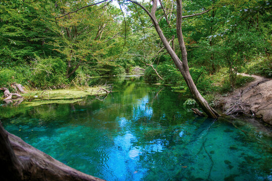 Incredibly beautiful fabulous place in Azerbaijan Nabran region river with incredible pure crystal water icy people jumping from a rope