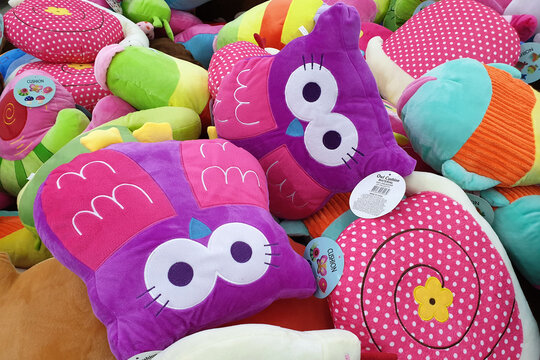 PENANG, MALAYSIA - JUNE 20, 2019: Stack of colorful arcade game soft toys in the game center. The soft toys sold in coin operating machine by using joystick to control the clamp to pull the toy up.