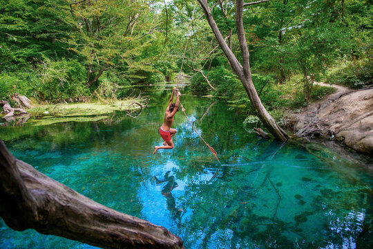 Incredibly beautiful fabulous place in Azerbaijan Nabran region river with incredible pure crystal water icy people jumping from a rope