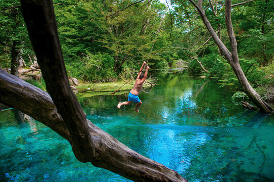 Incredibly beautiful fabulous place in Azerbaijan Nabran region river with incredible pure crystal water icy people jumping from a rope