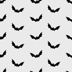 Fototapeta na wymiar Gothic Halloween seamless pattern made up many flying black bats. Holiday endless repeating texture for printing on package, wrapper, envelopes, cards, clothes or accessories. Ornamental paper design.