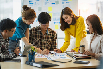 Business team meeting working with new startup project, discussion and analysis data the charts and graphs. Digital tablet calculator, laptop computer using, Business finances and accounting concept.