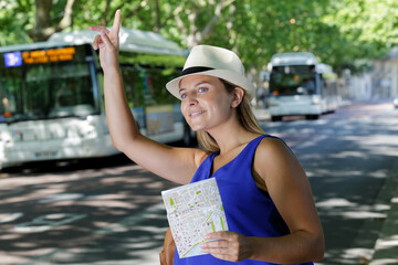 Fototapeta premium a happy woman calling a cab