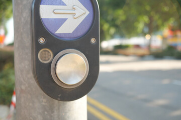close up of crossing signal button in singapore 