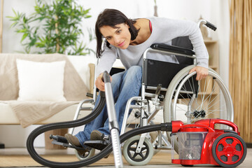 disable woman using a vacuum cleaner