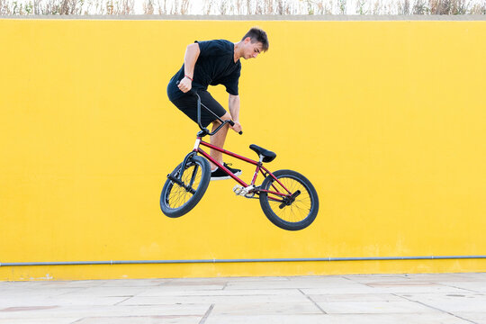 Man doing jump trick on BMX bike