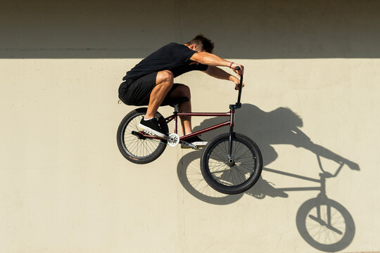 Man doing jump trick on BMX bike