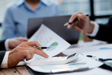 The sales department is having a monthly summary meeting to bring it to the department manager, they are verifying the correctness of the documents that are prepared before bringing in to the manager