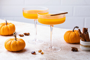 Halloween, Thanksgiving or fall cocktail pumpkin martini, homemade festive seasonal drink...