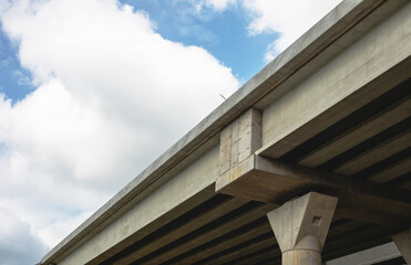 Fototapeta na wymiar Section of newly constructed elevated highway.Shot against a bright blue sky.
