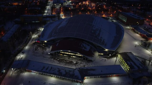 Russia, Krasnoyarsk. 20 November 2021: Sport Stadium Enisey. Home bandy arena Enisey club. Yenisei Ice Stadium, Krasnoyarsk from Drone.
