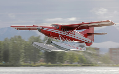 Seaplane taking off from a lake in Anchorage, Alaska