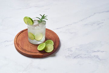 Caipirinha or caipiroska, fresh Brazilian cocktail made with ice, vodka and lime.