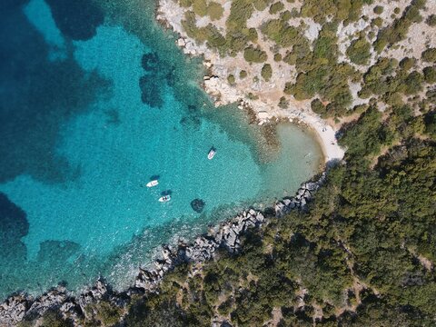 Aerial view of Potocnica, Lun and Novalja in island of Pag, archipelago of Croatia. Panoramic drone view of waterfront, idyllic and turquoise sea in Novalja, Adriatic Sea in Dalmatia region.
