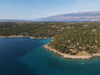 Aerial view of Potocnica, Lun and Novalja in island of Pag, archipelago of Croatia. Panoramic drone view of waterfront, idyllic and turquoise sea in Novalja, Adriatic Sea in Dalmatia region.
