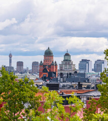 Towers, skyscrapers and tele tower down town a sunny day with cumulus clouds in Stockholm