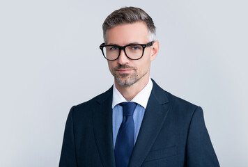 charismatic mature lawyer wearing glasses and business suit