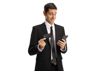 Amazed businessman with a smartphone using a credit card