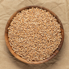 A bowl of wheat. Top view, close-up.