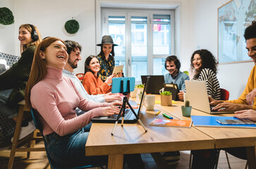 Young business people working inside coworking office - Focus on right girl hands