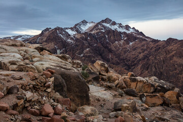 Obraz premium Amazing Sunrise at Sinai Mountain, Mount Moses with a Bedouin, Beautiful view from the mountain