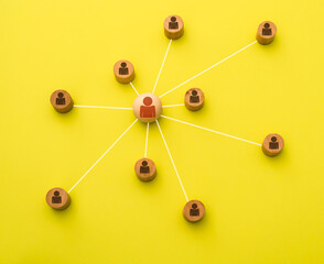 Representation with 3d icons of a network of social media contacts on a yellow background