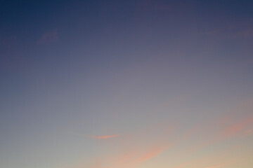 Colourful sky and clouds sunset background. Real amazing sunrise or sunset sky with gentle colorful clouds.