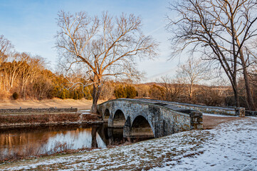 Fototapeta na wymiar A Snowy Sunset at Burnside Bridge, Antietam National Battlefield, Maryland USA, Sharpsburg, Maryland