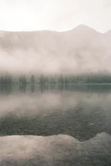 Foto auf Acrylglas Theme of relaxation and zen buddhism. Minimalism concept. Beautiful mystical landscape of Altai Lake on a foggy morning. © Olivia Rich