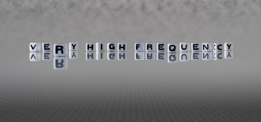 very high frequency word or concept represented by black and white letter cubes on a grey horizon...