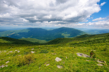Fototapeta na wymiar carpathian mountain summer landscape. green hills and stones on a sunny day with fluffy clouds. wonderful scenery of mnt runa