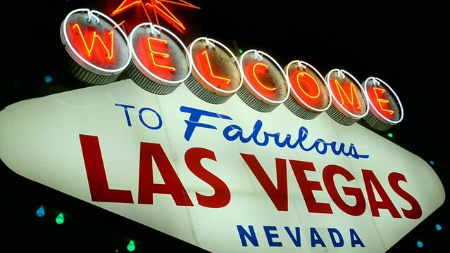 Las Vegas sign with red blinking led light on dark night sky, Nevada, USA. Welcome to fabulous sin city, entertainment diversity