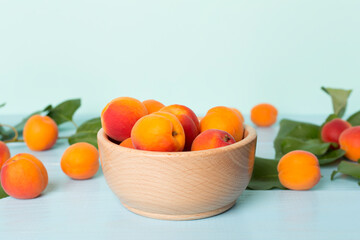 Composition with ripe apricots on wooden table