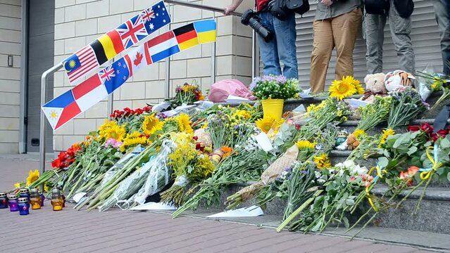 sunflower, flags and candles on the street, flowers memorable memorial on the street, sorrow diversity