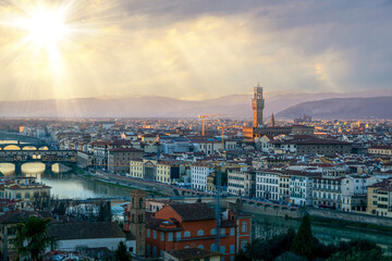 Fototapeta na wymiar Florence city view rain clouds and sun beams on sky famous architecture of touristic destination 