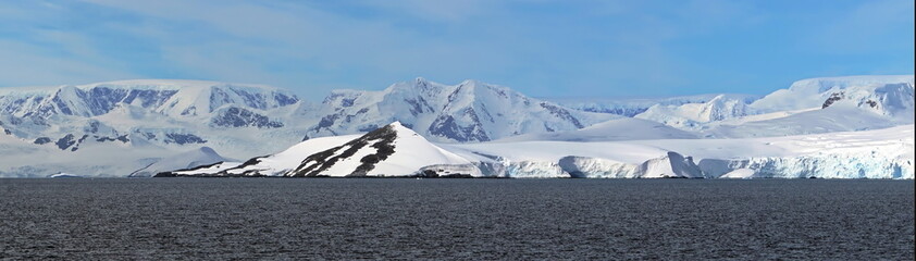 Fototapeta na wymiar Panorama of snow covered mountains at Portal Point in Antarctica