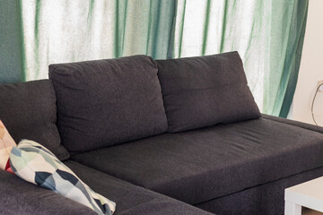 Close up shot of stylish cushions on the sofa. Interior