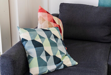 Close up shot of stylish cushions on the sofa. Interior