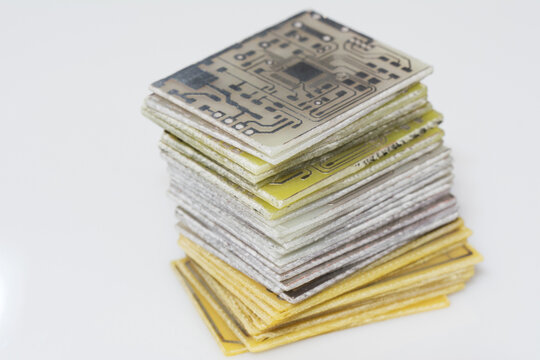 Bunch of Printed Circuit Board. Pile of PCB isolated on white background. Designing diy project. Selective soft focus.