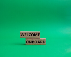 Welcome onboard symbol. Concept words Welcome onboard on wooden blocks. Beautiful green background. Business and Welcome onboard concept. Copy space.