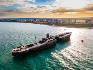 Drone photography of a rusty shipwreck at the Black Sea located next to Costinesti beach, in...
