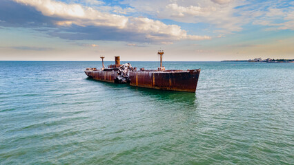 Drone photography of a rusty shipwreck at the Black Sea located next to Costinesti beach, in...