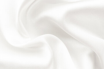 A twisted piece of white fabric. White material or texture with waves and folds. Wrinkled white fabric